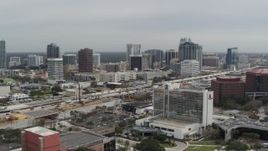 5.7K aerial stock footage a view of the city's skyline from a nearby hotel, Downtown Orlando, Florida Aerial Stock Footage | DX0003_233_032