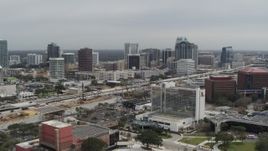 5.7K aerial stock footage a reverse view of the city's skyline from a nearby hotel, Downtown Orlando, Florida Aerial Stock Footage | DX0003_233_033