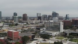 5.7K aerial stock footage approach the city's skyline from a nearby hotel, Downtown Orlando, Florida Aerial Stock Footage | DX0003_233_034