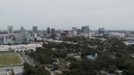 5.7K aerial stock footage of slowly passing by the city's skyline, Downtown Orlando, Florida Aerial Stock Footage | DX0003_233_047