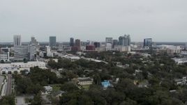 5.7K aerial stock footage focus on the city's skyline during descent, Downtown Orlando, Florida Aerial Stock Footage | DX0003_233_048