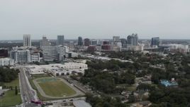 5.7K aerial stock footage of passing by the skyline of Downtown Orlando, Florida Aerial Stock Footage | DX0003_233_053