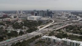 5.7K aerial stock footage of Amway Center, city skyline, and freeway interchange, Downtown Orlando, Florida Aerial Stock Footage | DX0003_234_001