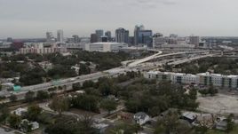5.7K aerial stock footage a view of Amway Center, city skyline, freeway interchange, Downtown Orlando, Florida Aerial Stock Footage | DX0003_234_007