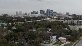 5.7K aerial stock footage ascend past Amway Center, city skyline, freeway interchange, Downtown Orlando, Florida Aerial Stock Footage | DX0003_234_008