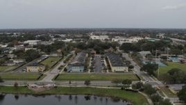 5.7K aerial stock footage fly toward an apartment complex in Orlando, Florida Aerial Stock Footage | DX0003_234_012