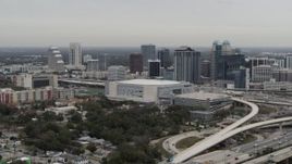 5.7K aerial stock footage flying past Amway Center and city skyline, Downtown Orlando, Florida Aerial Stock Footage | DX0003_234_027