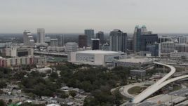 5.7K aerial stock footage of Amway Center arena and city skyline, Downtown Orlando, Florida Aerial Stock Footage | DX0003_234_029