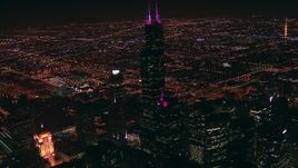 HD stock footage aerial video approach iconic skyscraper, Willis Tower, at night, Downtown Chicago, Illinois Aerial Stock Footage | ED0001_000018