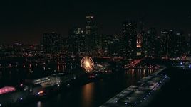HD stock footage aerial video of a reverse view of Navy Pier and Ferris wheel, and the skyline of Downtown Chicago at night, Illinois Aerial Stock Footage | ED0001_000026