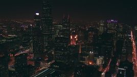 HD stock footage aerial video tilt from city streets to reveal Willis Tower skyscraper at night, Downtown Chicago, Illinois Aerial Stock Footage | ED0001_000035