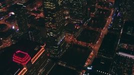 HD stock footage aerial video pan across Merchandise Mart and bridges over the Chicago River at night, Downtown Chicago, Illinois Aerial Stock Footage | ED0001_000038