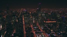 HD stock footage aerial video of Downtown Chicago, Illinois skyscrapers and city streets at night Aerial Stock Footage | ED0001_000055