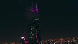 HD stock footage aerial video tilt from the top of Franklin Center to Willis Tower skyscraper at night, Downtown Chicago, Illinois Aerial Stock Footage | ED0001_000063