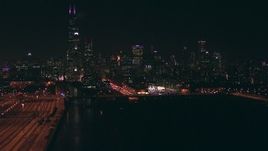 HD stock footage aerial video follow the Chicago River to approach Willis Tower skyscraper and Downtown Chicago, Illinois at night Aerial Stock Footage | ED0001_000068
