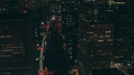 HD stock footage aerial video follow the Chicago River north over bridges and past skyscrapers at night Downtown Chicago, Illinois Aerial Stock Footage | ED0001_000071