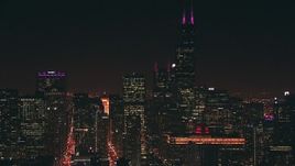 HD stock footage aerial video of iconic Willis Tower skyscraper and city high-rises at night, Downtown Chicago, Illinois Aerial Stock Footage | ED0001_000083