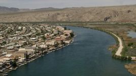 4K aerial stock footage of waterfront houses and docks on the Colorado River in Bullhead City, Arizona Aerial Stock Footage | FG0001_000015