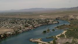 4K aerial stock footage of houses and docks beside a bend in the Colorado River in Bullhead City, Arizona Aerial Stock Footage | FG0001_000019