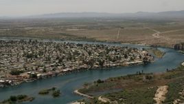 4K aerial stock footage of residential neighborhood beside the Colorado River in Bullhead City, Arizona Aerial Stock Footage | FG0001_000020