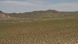 4K aerial stock footage fly over Mojave Desert to approach Dead Mountains Wilderness Area in California Aerial Stock Footage | FG0001_000026