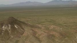 4K aerial stock footage fly over hills and open Mojave Desert in San Bernardino County, California Aerial Stock Footage | FG0001_000042