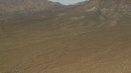 4K aerial stock footage tilt to approach mountains in the Mojave Desert in San Bernardino County, California Aerial Stock Footage | FG0001_000047