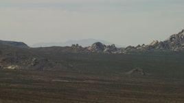 4K aerial stock footage of Mojave Desert rock formations in San Bernardino County, California Aerial Stock Footage | FG0001_000050