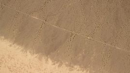 4K aerial stock footage of bird's eye view of a Mojave Desert plain in San Bernardino County, California Aerial Stock Footage | FG0001_000068