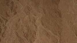 4K aerial stock footage of an overhead view of an arid Mojave Desert plain in San Bernardino County, California Aerial Stock Footage | FG0001_000074