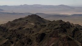 4K aerial stock footage of the rugged summit of a Mojave Desert mountain in San Bernardino County, California Aerial Stock Footage | FG0001_000082