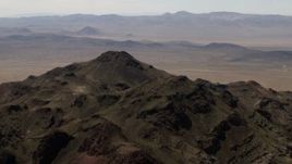 4K aerial stock footage top of a rugged Mojave Desert mountain in San Bernardino County, California Aerial Stock Footage | FG0001_000083