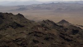 4K aerial stock footage summit of a Mojave Desert mountain in San Bernardino County, California Aerial Stock Footage | FG0001_000085