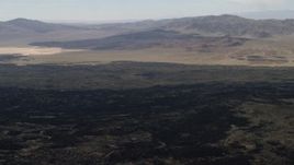 4K aerial stock footage pan across the lava fields by the Pisgah Crater in Mojave Desert, San Bernardino County, California Aerial Stock Footage | FG0001_000088
