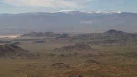 4K aerial stock footage of the San Bernardino Mountains behind Mojave Desert mountains, San Bernardino County, California Aerial Stock Footage | FG0001_000113