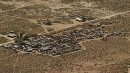 4K aerial stock footage of an auto junkyard in the Mojave Desert, San Bernardino County, California Aerial Stock Footage | FG0001_000121