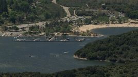 4K aerial stock footage of watercraft near the marina and the beach on Silverwood Lake, California Aerial Stock Footage | FG0001_000132