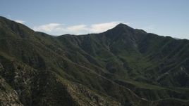 4K aerial stock footage pan across a green mountain ridge in the San Gabriel Mountains, California Aerial Stock Footage | FG0001_000157