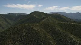 4K aerial stock footage approach and fly over a green mountain ridge in the San Gabriel Mountains, California Aerial Stock Footage | FG0001_000163