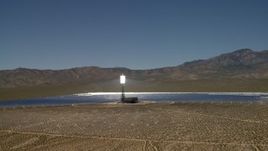 4K aerial stock footage tilt to reveal and orbit an array at the Ivanpah Solar Electric Generating System in California Aerial Stock Footage | FG0001_000193