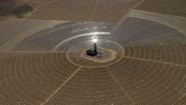 4K aerial stock footage tilt to reveal and approach one of the solar power structures at the Ivanpah Solar Electric Generating System in California Aerial Stock Footage | FG0001_000213