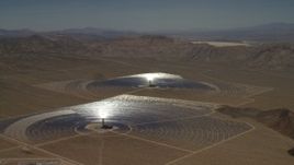 4K aerial stock footage of two of the mirror arrays and power towers at the Ivanpah Solar Electric Generating System in California Aerial Stock Footage | FG0001_000221