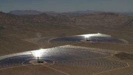 4K aerial stock footage of a pair of mirror arrays and power towers at the Ivanpah Solar Electric Generating System in California Aerial Stock Footage | FG0001_000222