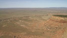 4K aerial stock footage tilt from desert vegetation to reveal and approach the edge of a mesa in the Arizona Desert Aerial Stock Footage | FG0001_000226