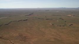 4K aerial stock footage of passing a wide desert plain in the Arizona Desert Aerial Stock Footage | FG0001_000231