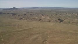 4K aerial stock footage of low mesas on a wide desert plain in the Arizona Desert Aerial Stock Footage | FG0001_000232