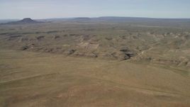 4K aerial stock footage of low mesas on a desert plain in the Arizona Desert Aerial Stock Footage | FG0001_000233