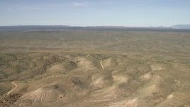 4K aerial stock footage tilt from a bird's eye view of mesas to reveal a wide plain in the Arizona Desert Aerial Stock Footage | FG0001_000237