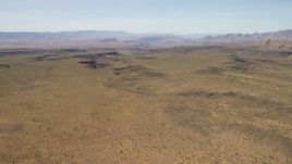 4K aerial stock footage of a wide plain and canyons in the Arizona Desert Aerial Stock Footage | FG0001_000246