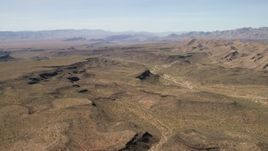 4K aerial stock footage of a wide canyon through the desert plain in the Arizona Desert Aerial Stock Footage | FG0001_000248